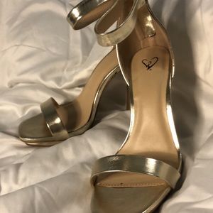 Gold stiletto platform heels